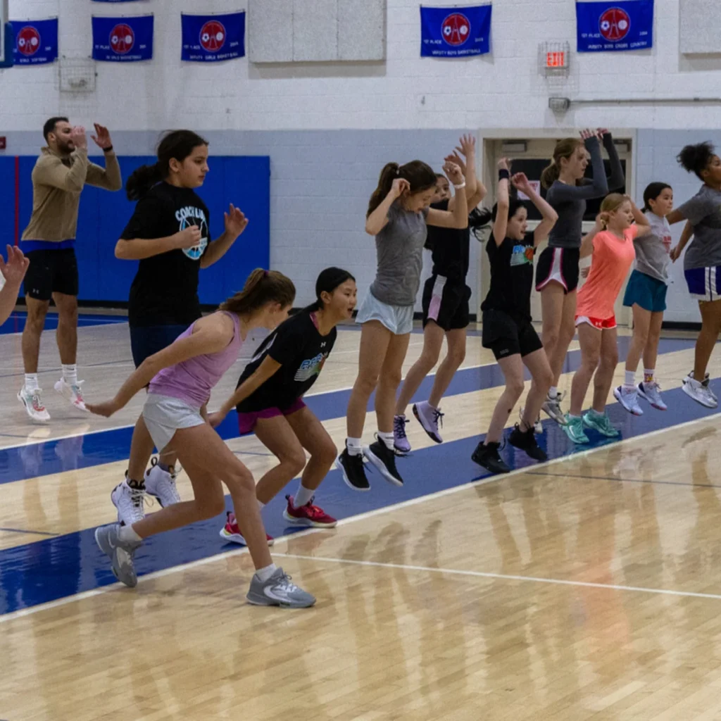 Group of athletes at a UGIS basketball clinic