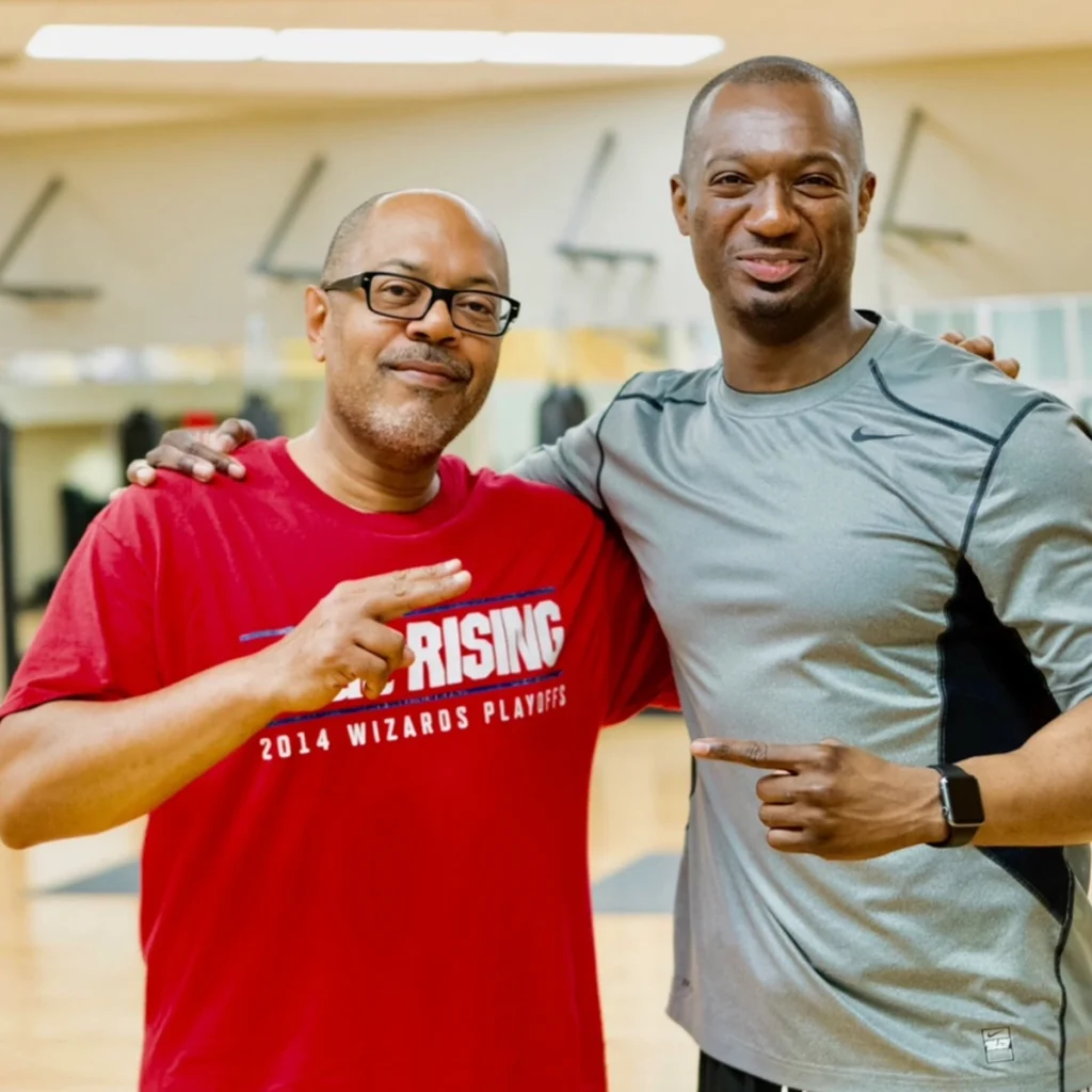Coach Emmanuel connecting with young athletes off the court
