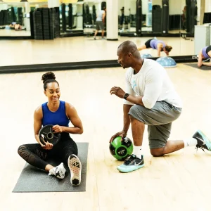 Coach Emmanuel coaching an adult client during a fitness training session