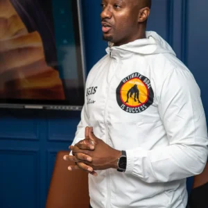 Coach Emmanuel speaking during a consulting or training presentation